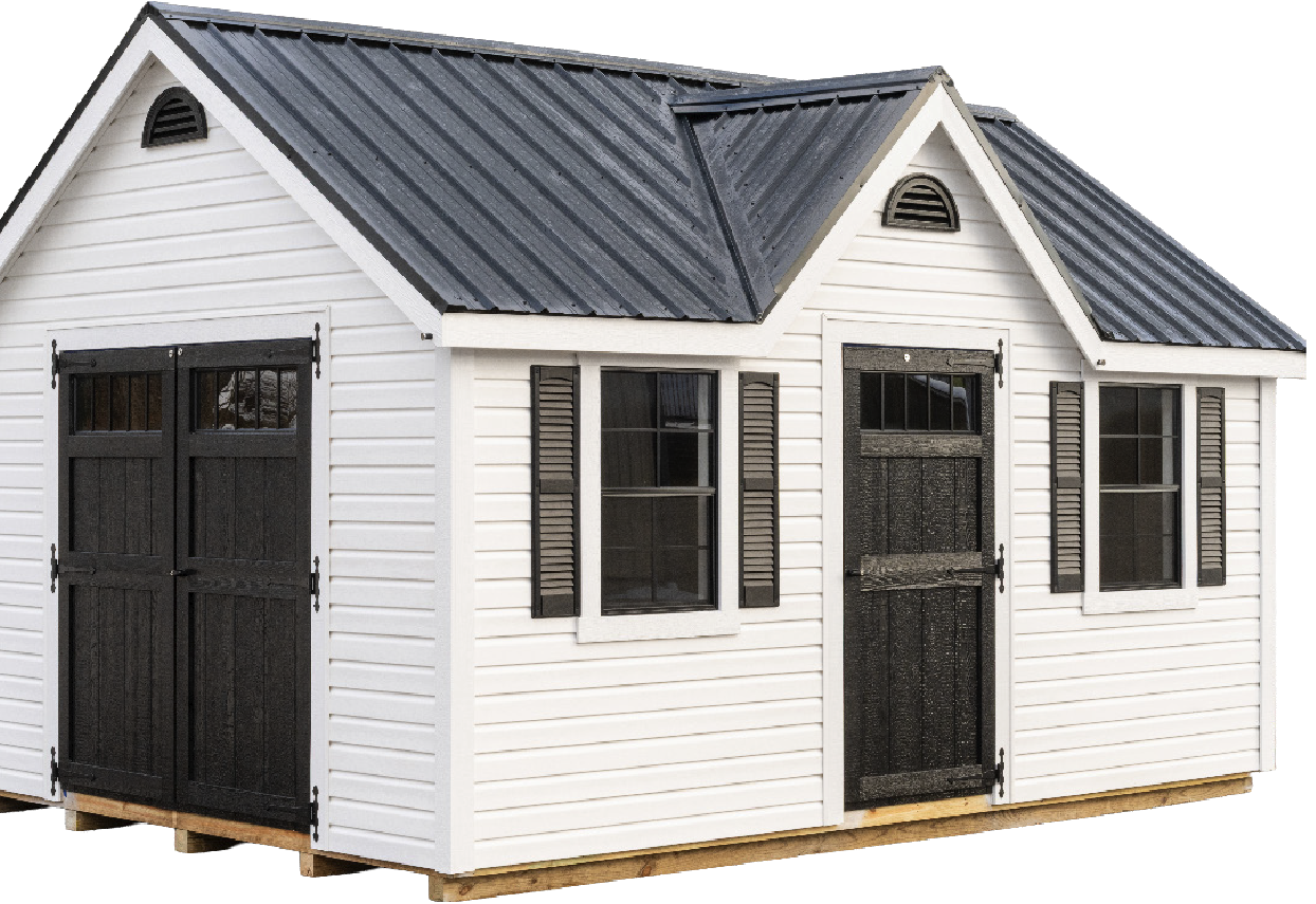 A white Mast Mini Barn Chalet with white siding, black trim, and a metal roof