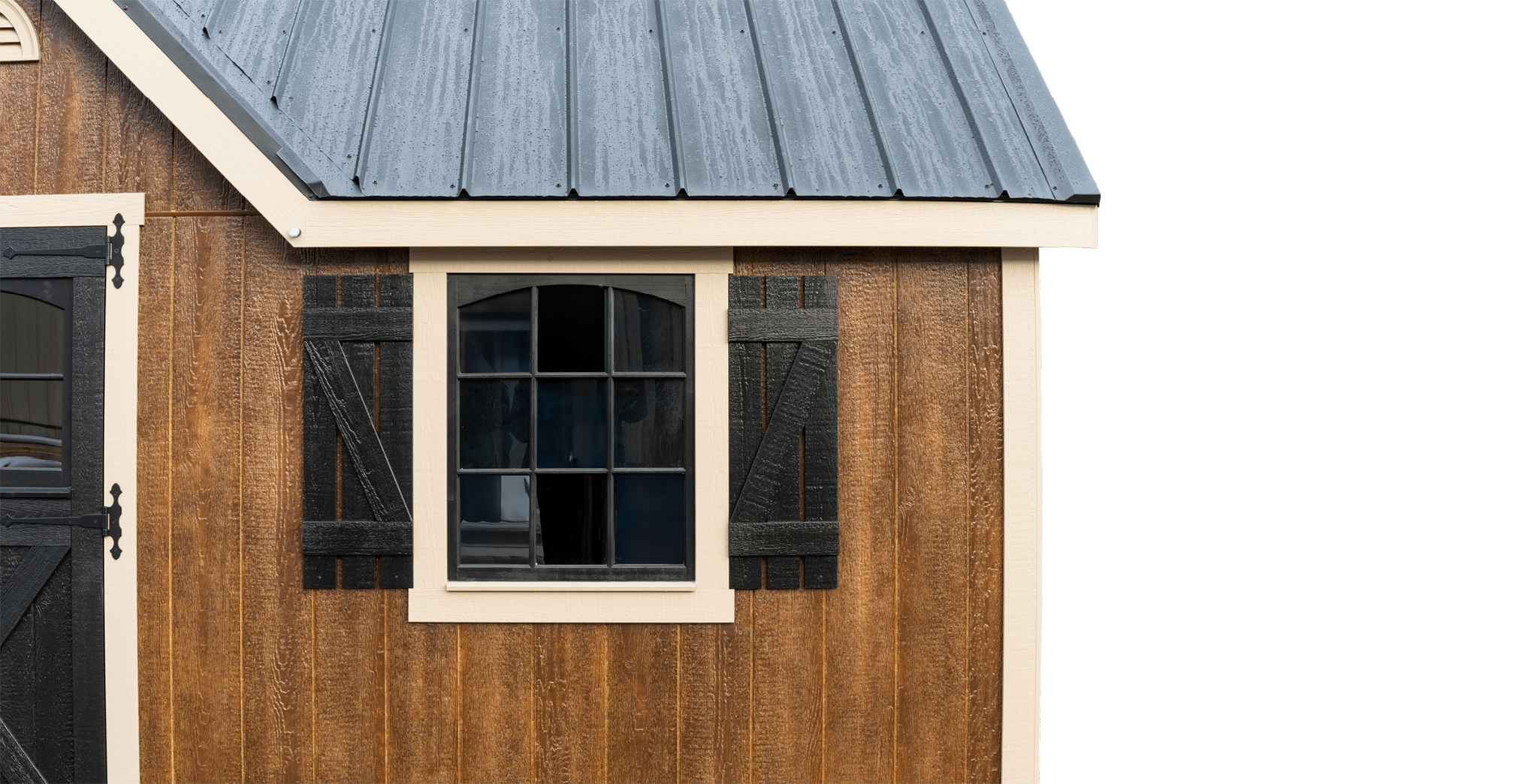 A brown Mast Mini Barn Chalet shed in deluxe package with LP Smartside and a black metal roof