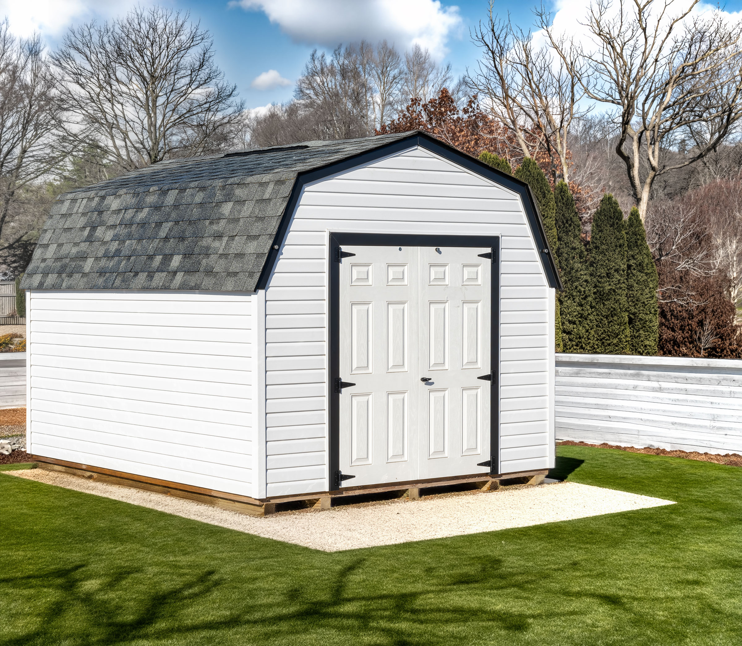 A 10x12 Mast Mini Barn 9ft Vinyl Pro shed shown with black architectural shingles, White with Black trim