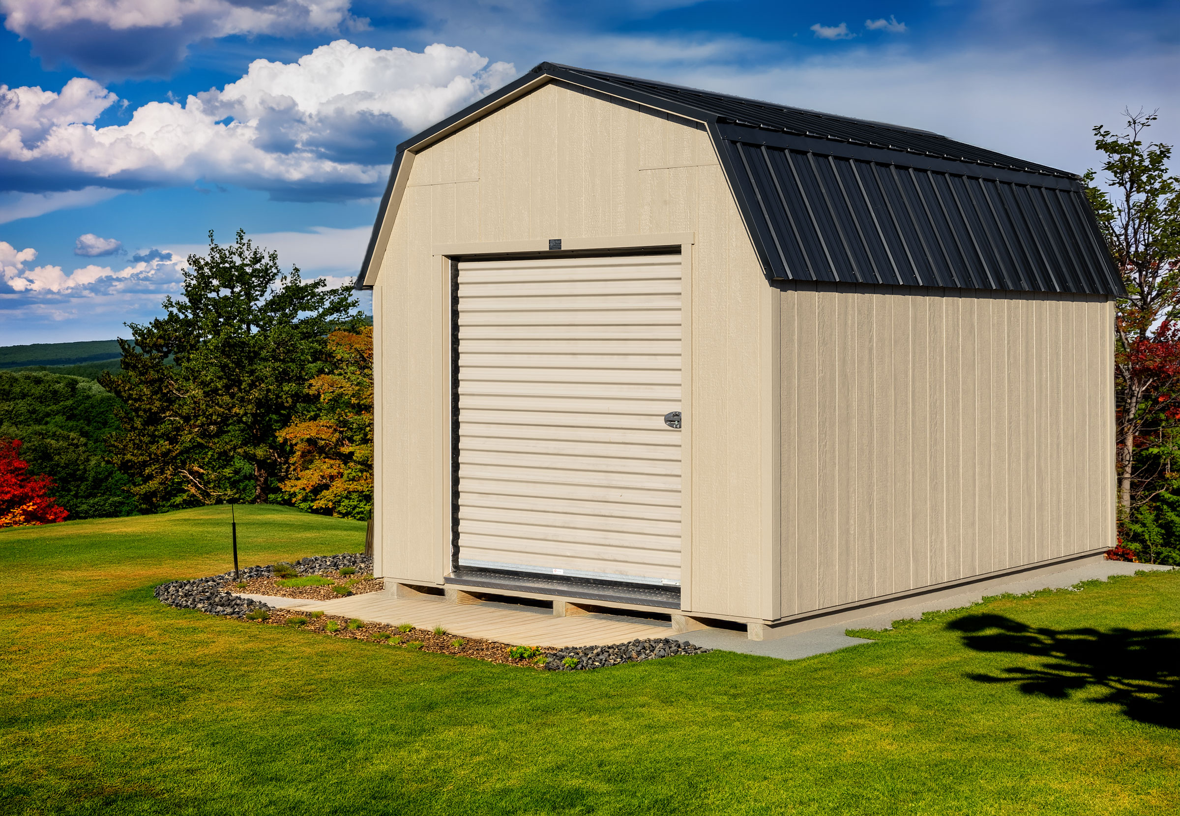 A 10x14 Mast Mini Barn High Barn shed shown in clay with clay trim, roll-up door upgrade, and a black metal roof