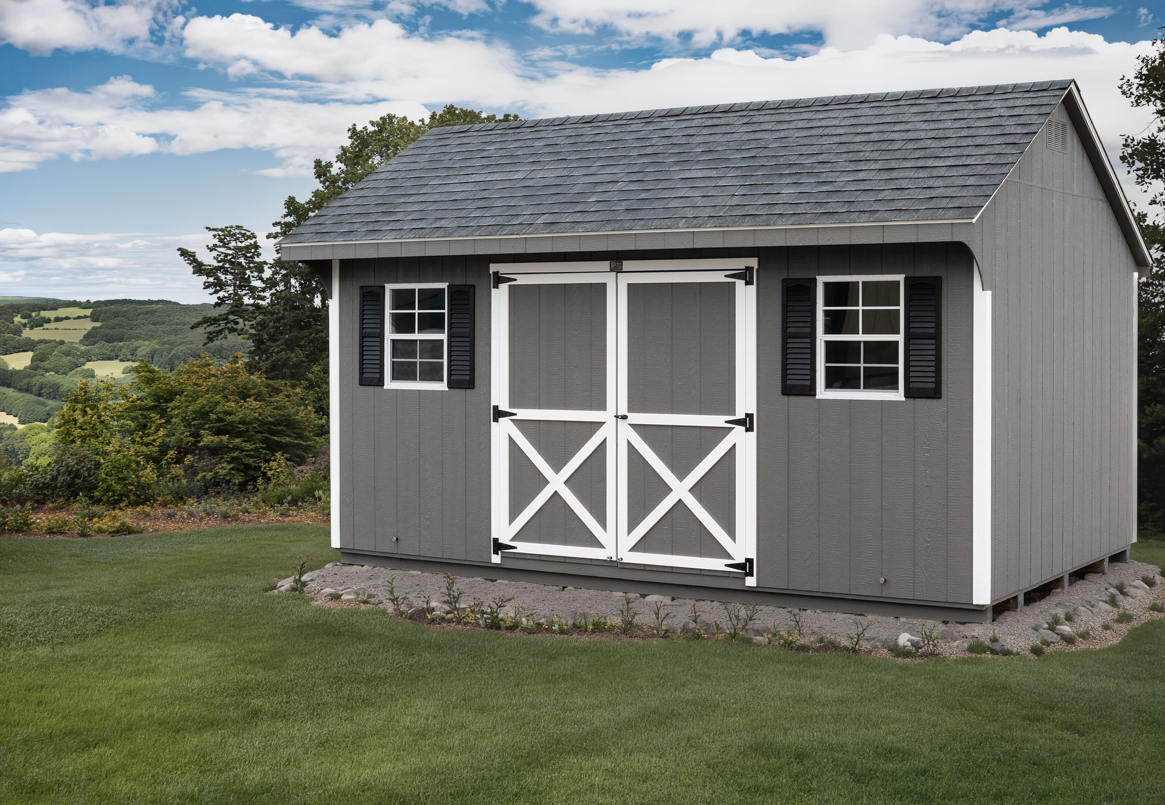 A 10x16 Mast Mini Barn Carriage House shed shown in Charcoal Grey with White trim