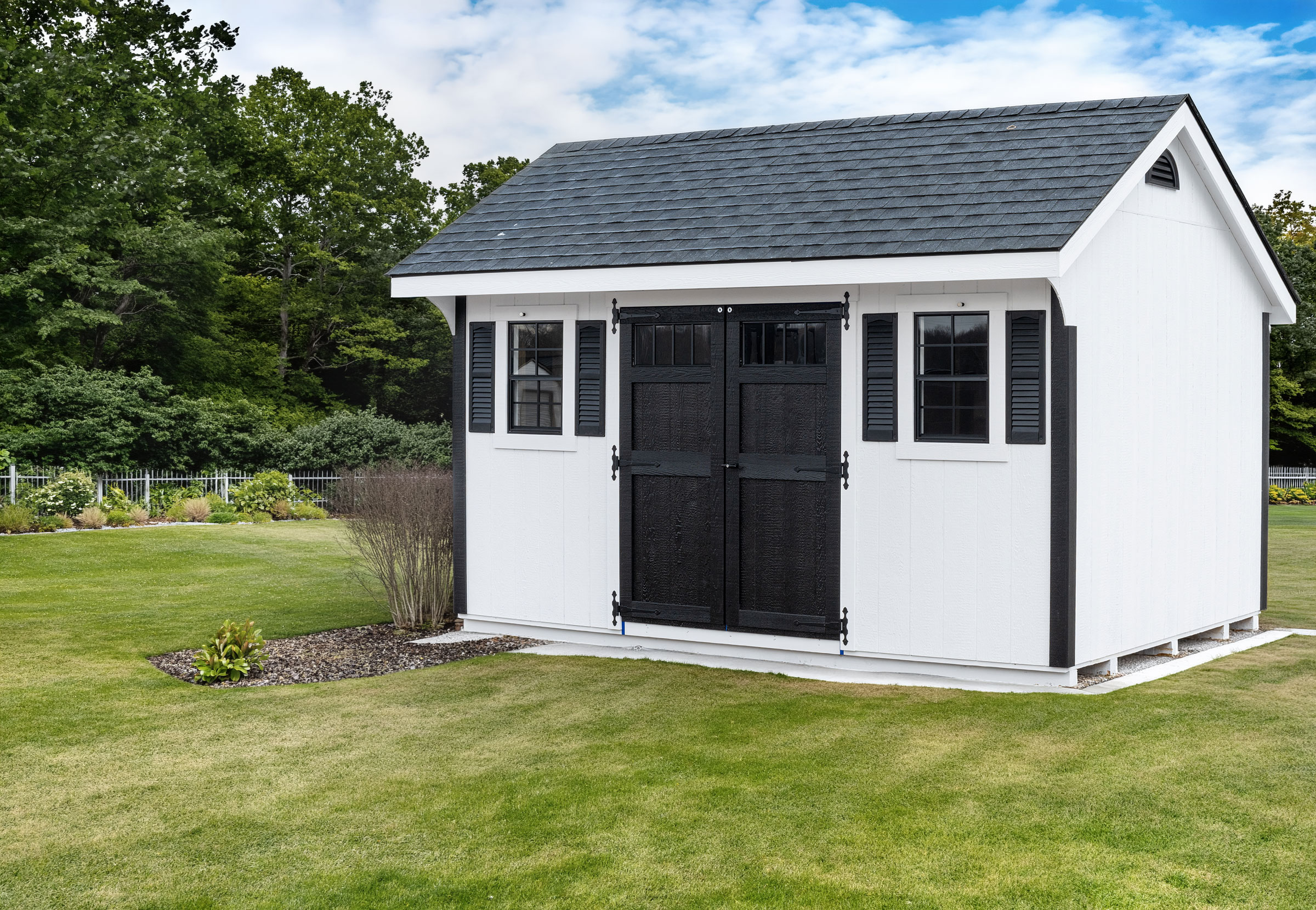 A 10x16 Mast Mini Barn Carriage House shed shown in White with Black trim