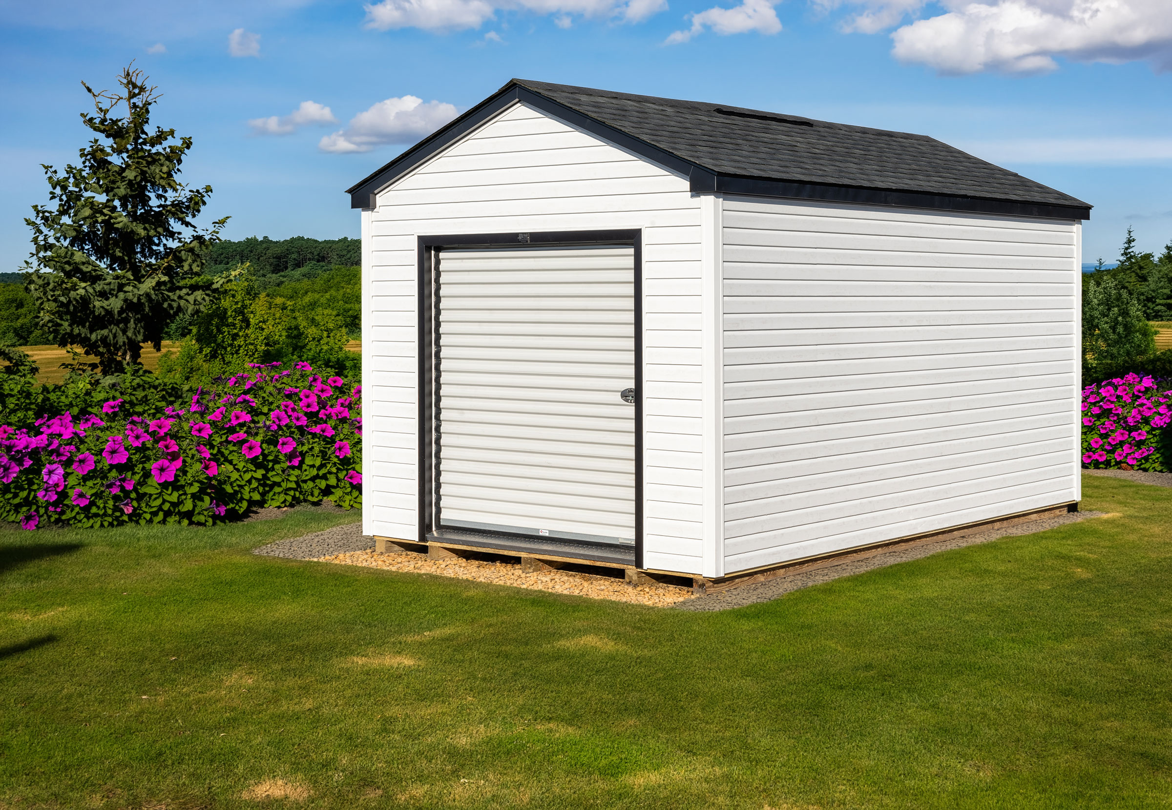 A 10x16 Mast Mini Barn Cottage shed shown in White Vinyl with Black trim