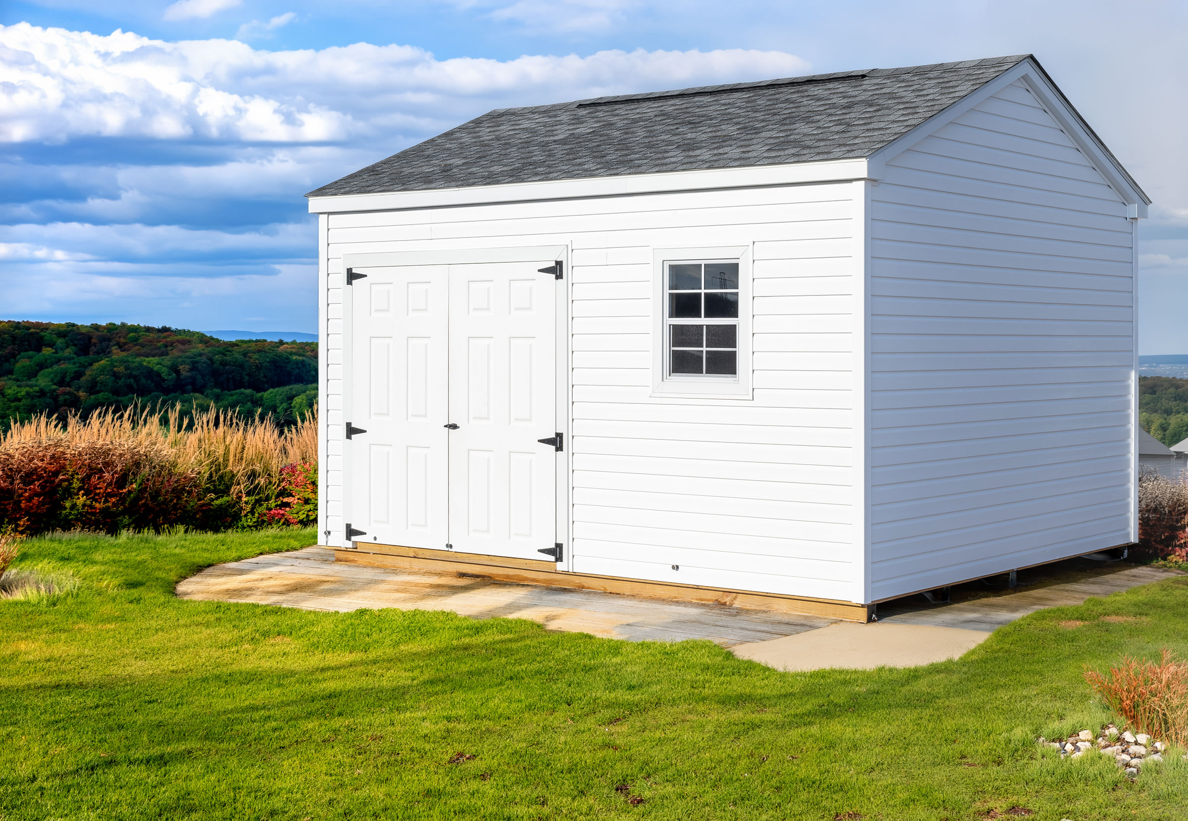 A 12x12 Mast Mini Barn Cottage shed shown in White Vinyl with White trim