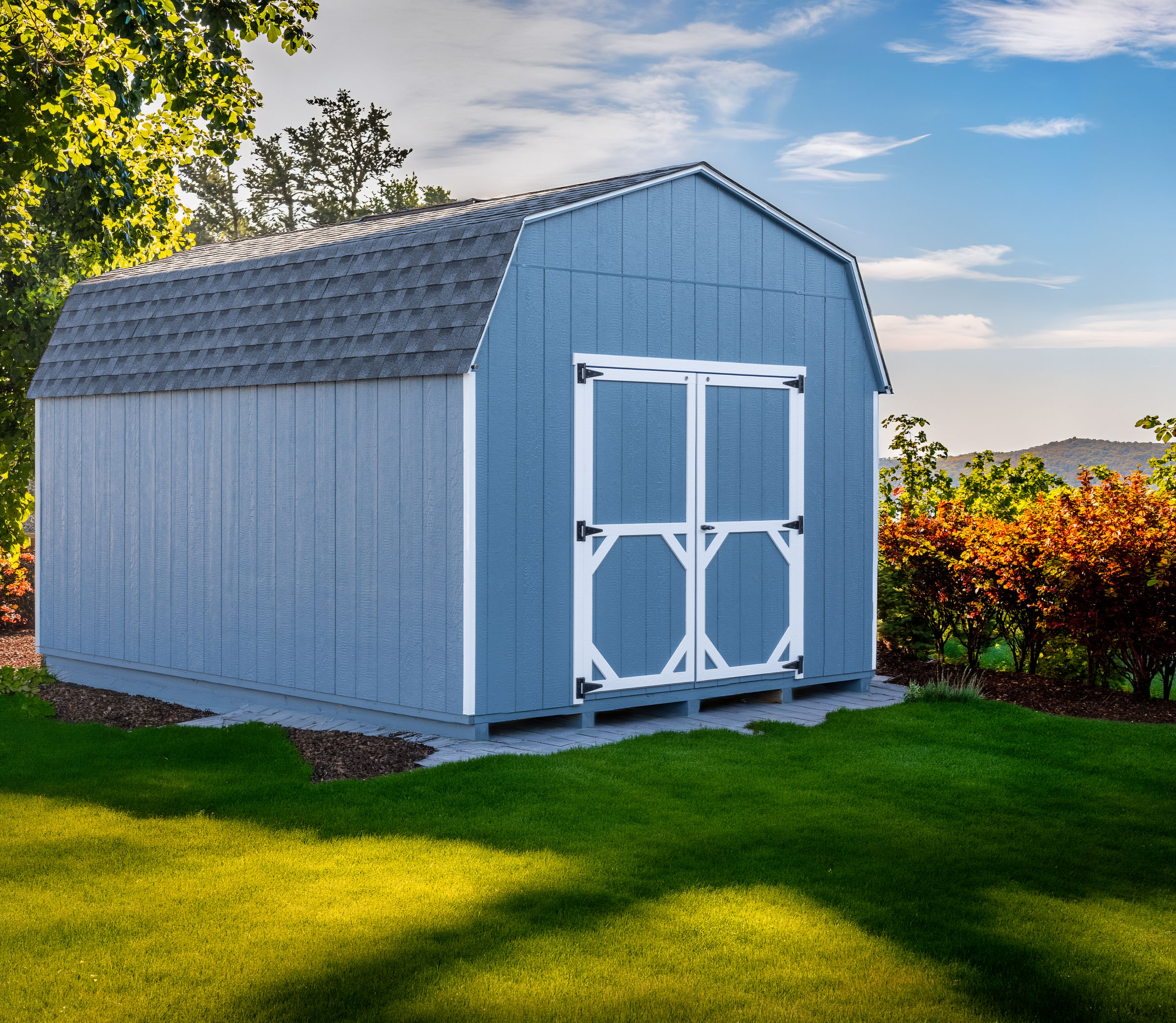 A 12x16 Mast Mini Barn 10ft Lofted Painted Pro shed shown with architectural shingles, Navy Blue with White trim