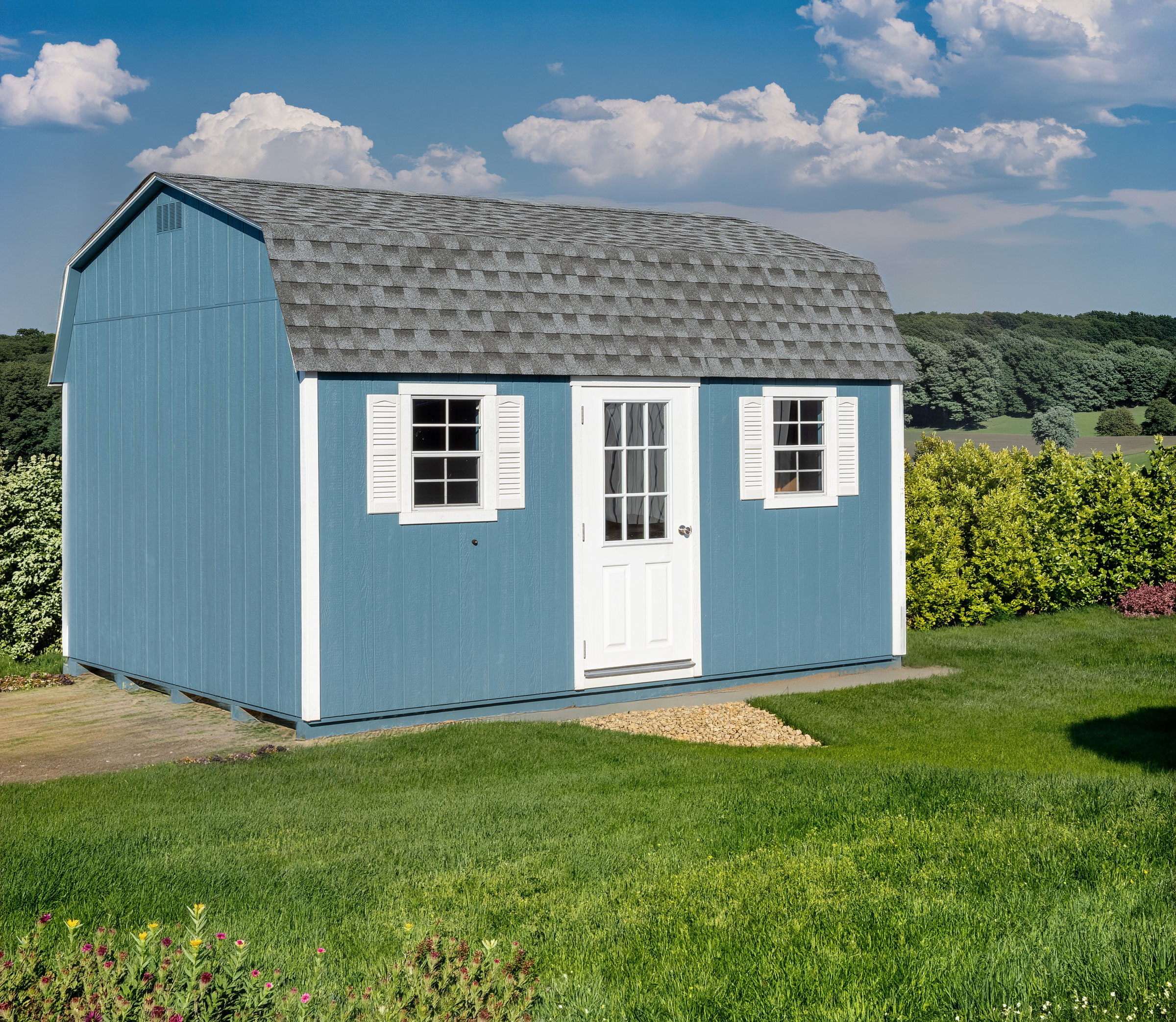 A 12x16 Mast Mini Barn Dutch Barn shed shown in Wedgewood Blue with White trim and architectural shingle roof