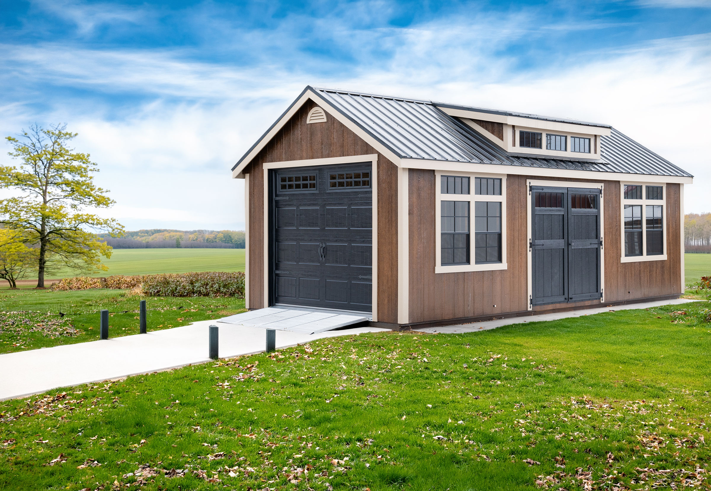 A 12x24 Cape Cod Garage shown in Chestnut Brown Urethane, Tuscan Clay trim, Black doors, and Black metal roof