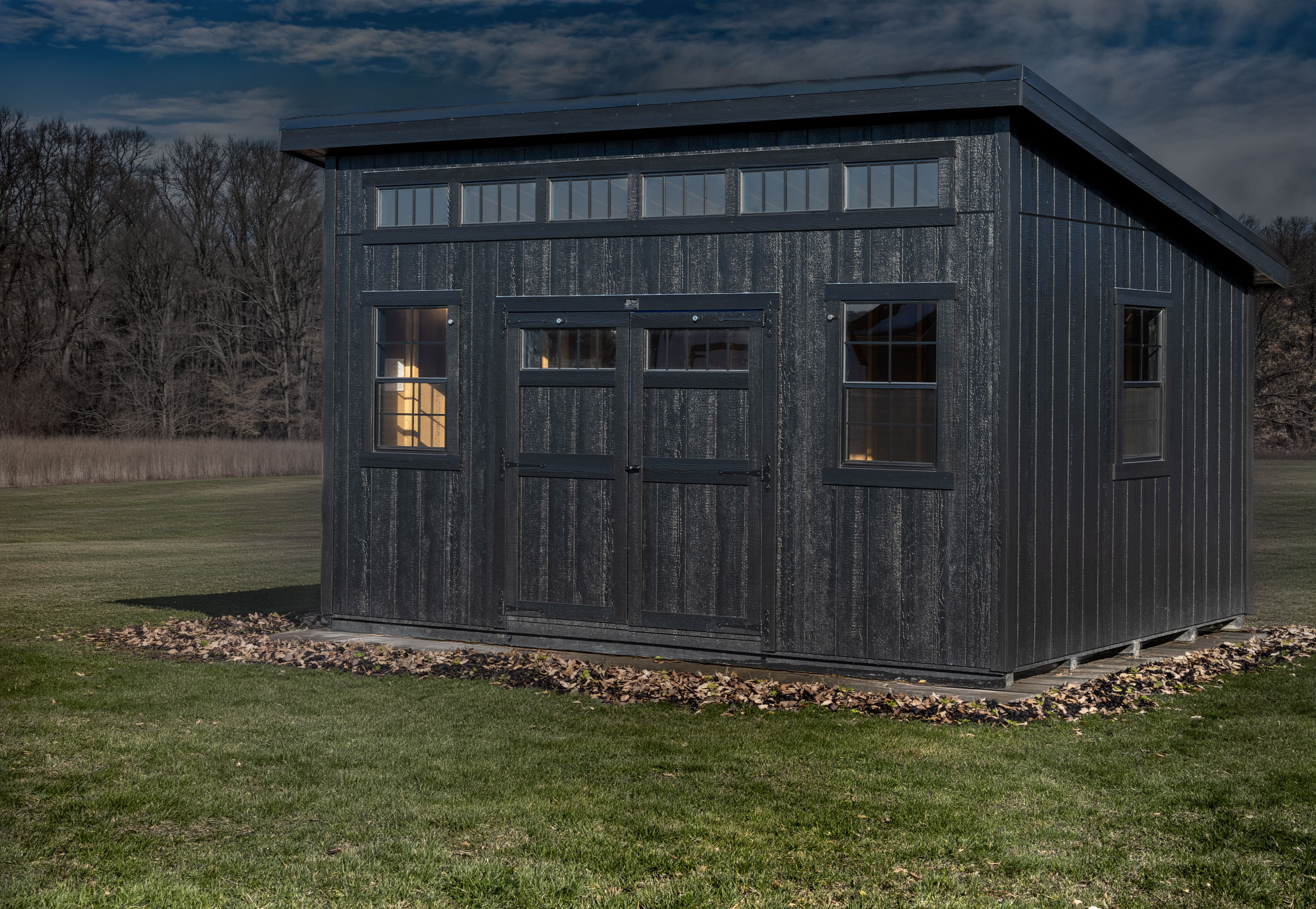A Mast Mini Barn Klassic Studio shown in Black with Black trim