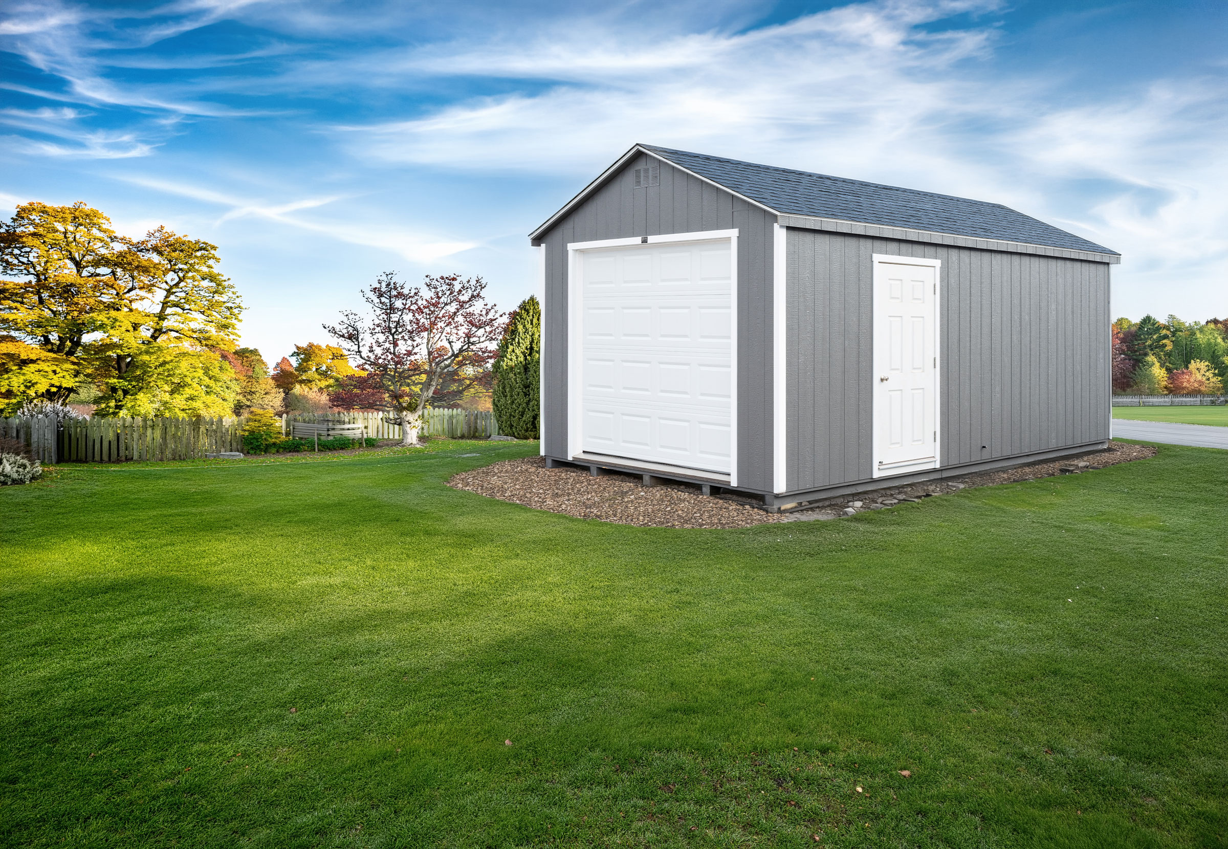 A 12x20 Mast Mini Barn Garage shown in Charcoal Grey with White trim