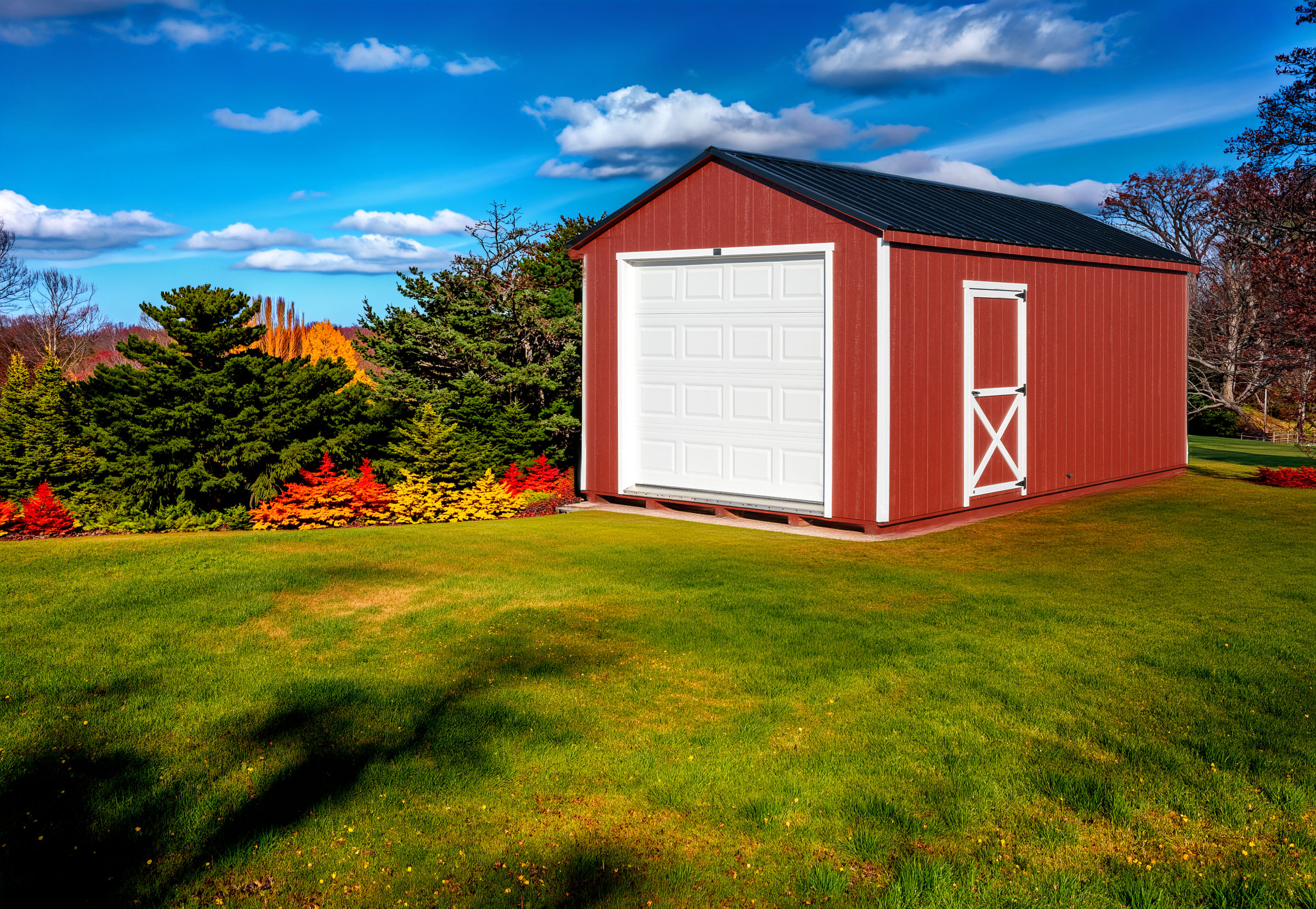 A 12x20 Mast Mini Barn Garage shown in Stauffer Red with White trim