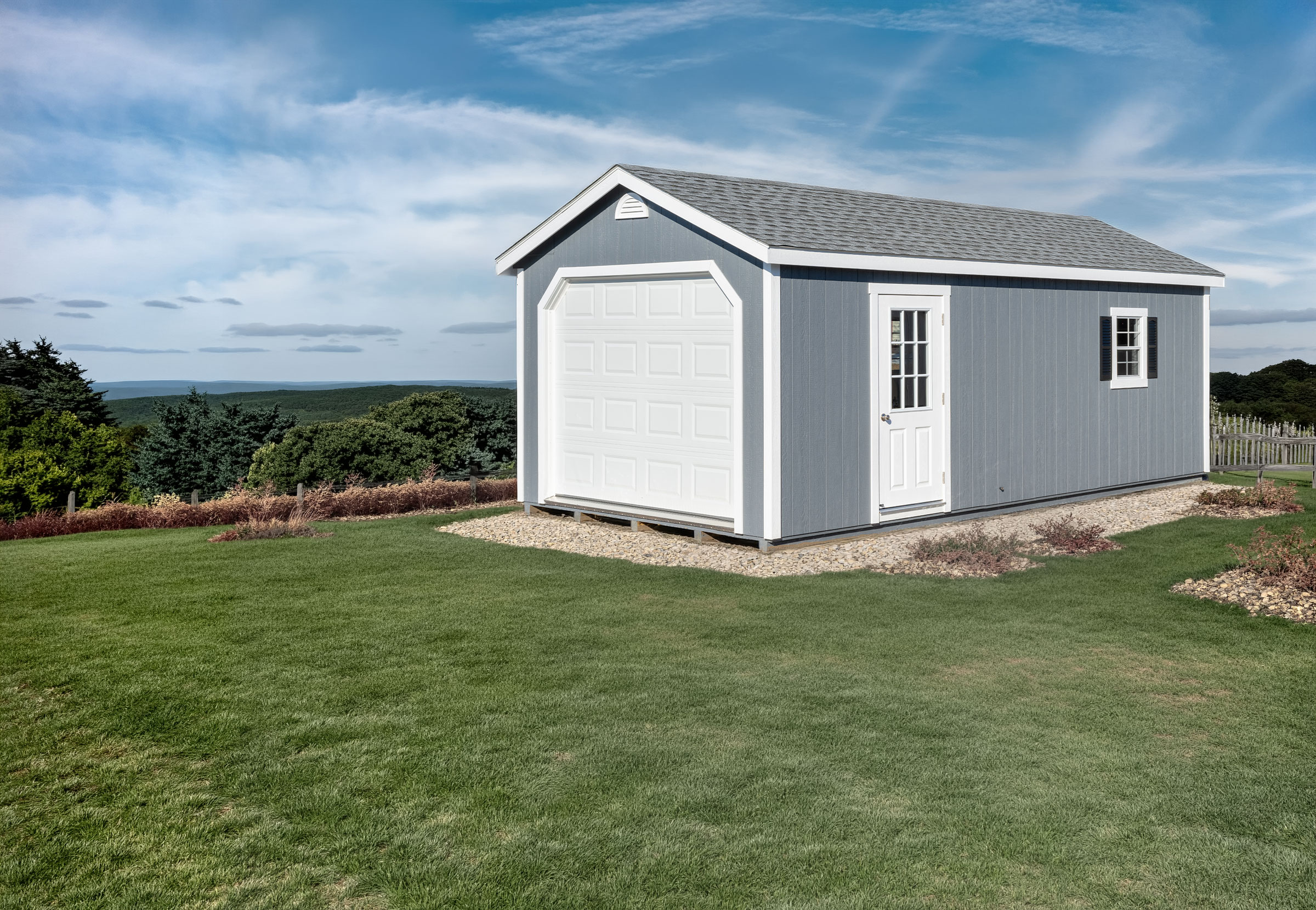 A 12x24 Mast Mini Barn Garage shown in Dawn Grey with White trim, deluxe package